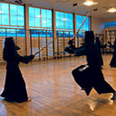 Kendoka praciticing men strikes in kendo
