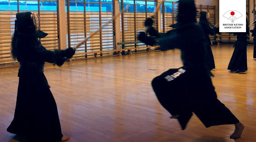Two Bristol kendoka training with British Kendo Association logo